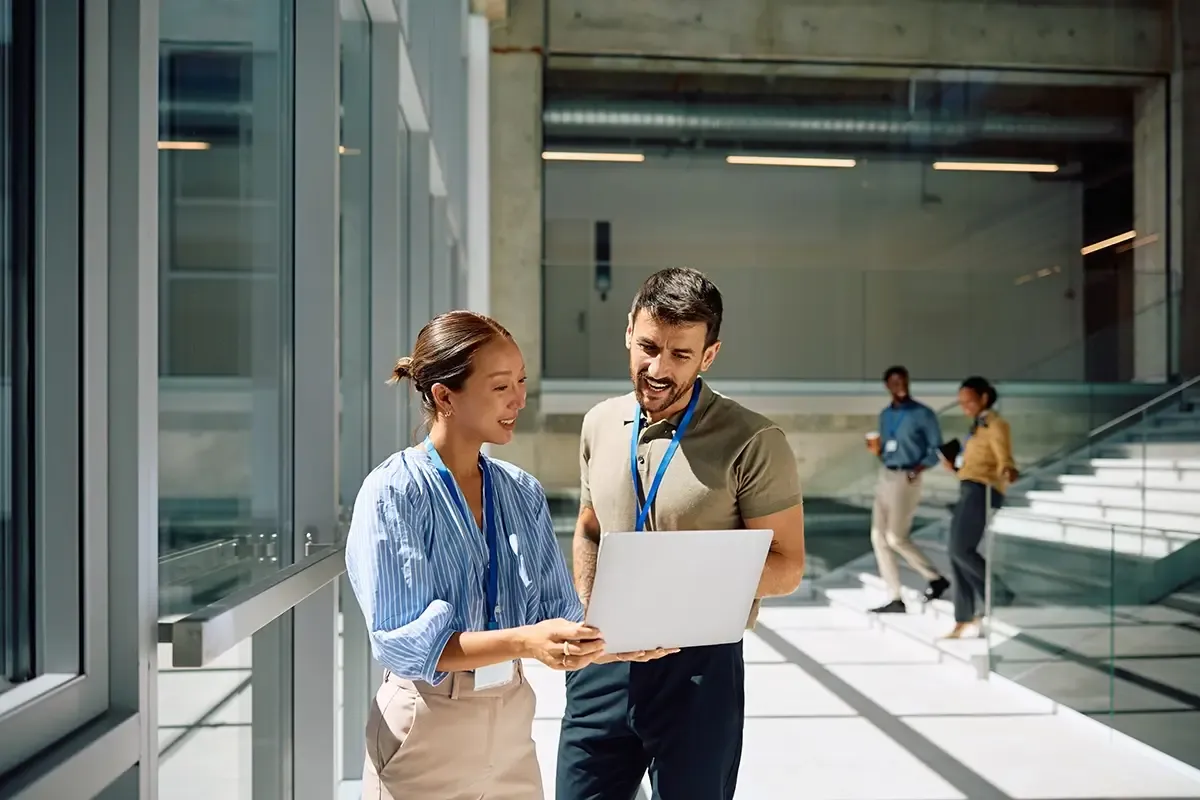 People looking at a computer